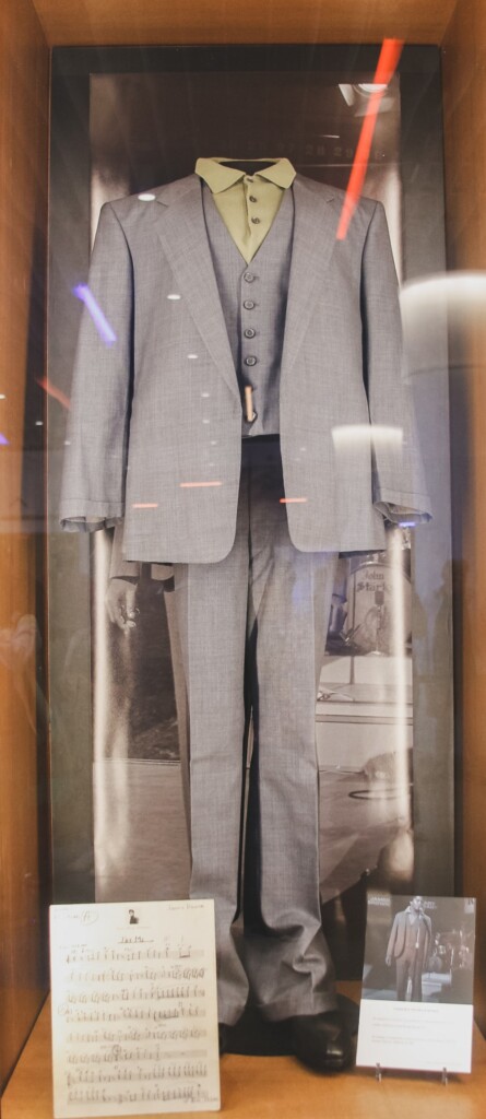 glass exhibition case featuring suit worn by James Brown