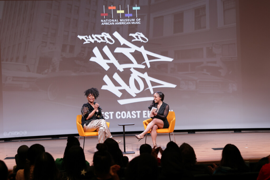 Artist and moderator on stage for Q&A