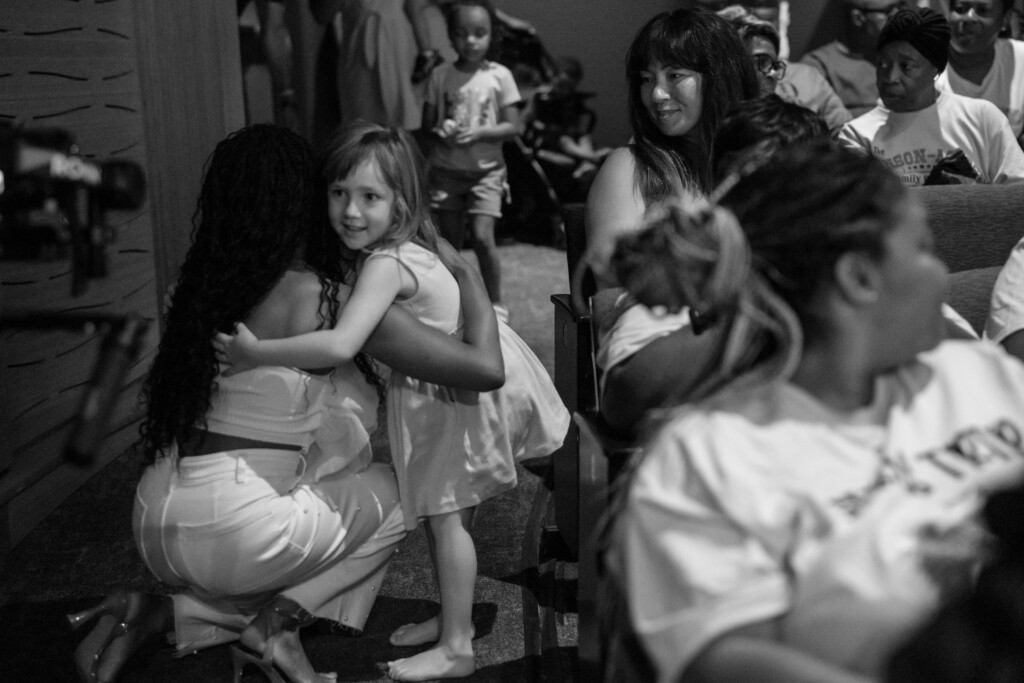 Puppeteer, Megan Piphus hugging small child at her event