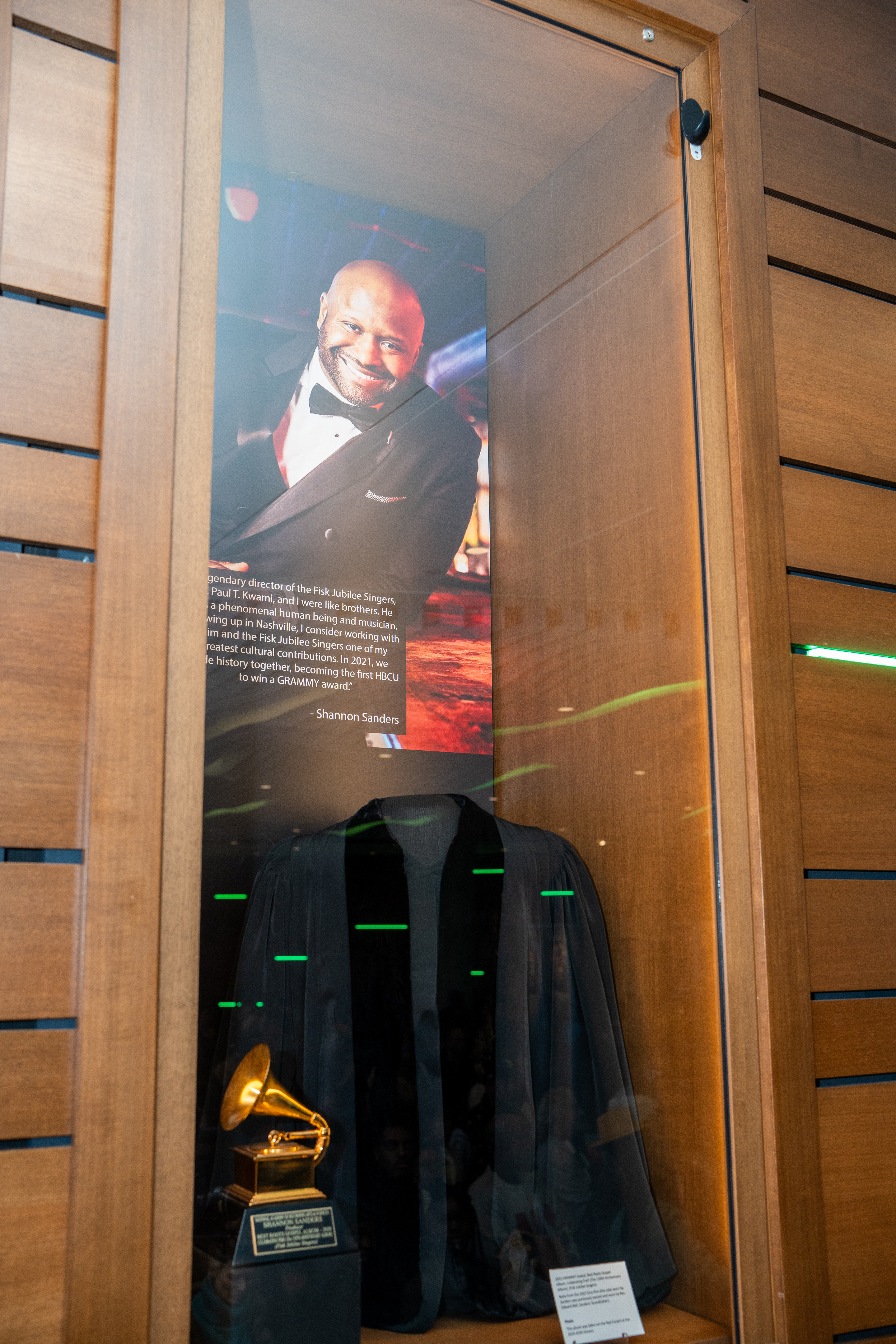 glass exhibition case featuring artifacts from Shannon Sanders