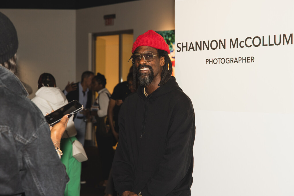 Artist posing for camera in gallery