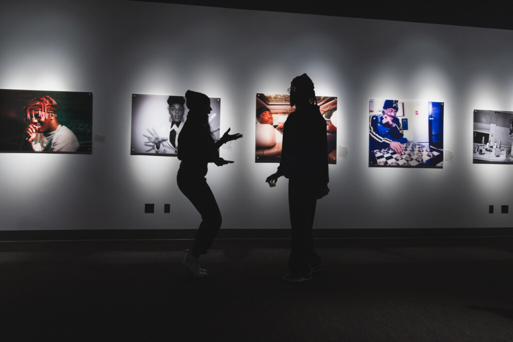 silhouette of artist and guest in gallery